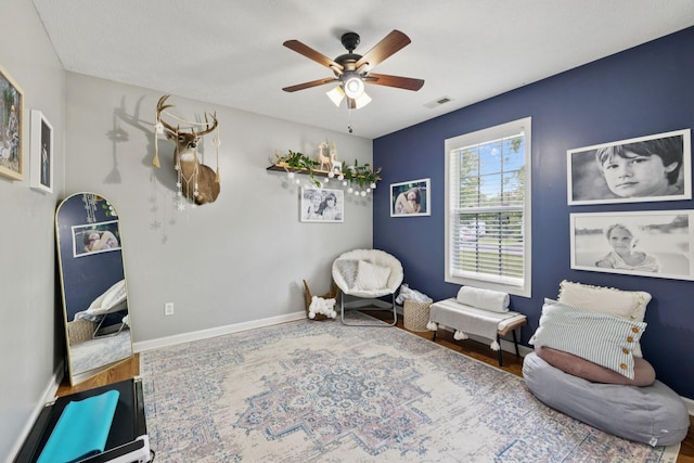 123 Hubbard St, Hohenwald, TN 38462 - living area featuring ceiling fan, baseboards, and wood finished floors