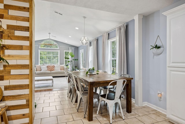 123 Hubbard St, Hohenwald, TN 38462 - dining area featuring vaulted ceiling, light tile patterned flooring, and baseboards