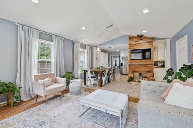 123 Hubbard St, Hohenwald, TN 38462 - living room with lofted ceiling, light wood-style floors, and recessed lighting