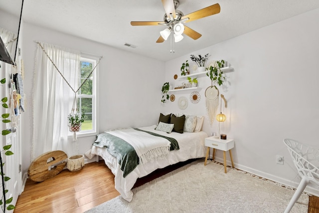 123 Hubbard St, Hohenwald, TN 38462 - bedroom with wood finished floors, baseboards, and ceiling fan