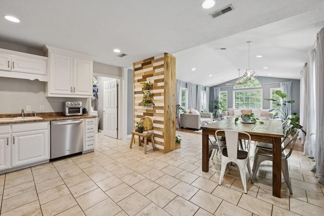 123 Hubbard St, Hohenwald, TN 38462 - kitchen with dishwasher, open floor plan, vaulted ceiling, a sink, and white cabinetry