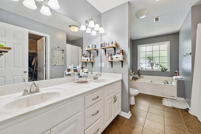 123 Hubbard St, Hohenwald, TN 38462 - full bath with tile patterned floors, toilet, double vanity, a bath, and baseboards