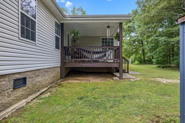123 Hubbard St, Hohenwald, TN 38462 - view of green lawn with a deck