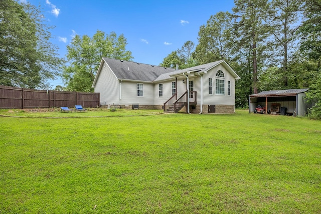 123 Hubbard St, Hohenwald, TN 38462 - back of house with a pole building and an outbuilding