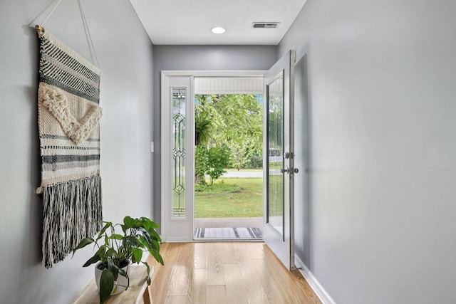 123 Hubbard St, Hohenwald, TN 38462 - doorway with wood finished floors and baseboards