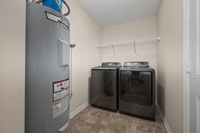 4713 Pompano Ln, Murfreesboro, TN 37128 - laundry area featuring water heater, separate washer and dryer, stone finish floors, and a textured ceiling