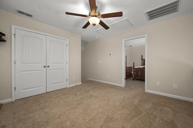 4713 Pompano Ln, Murfreesboro, TN 37128 - unfurnished bedroom featuring attic access, carpet, a closet, and a ceiling fan