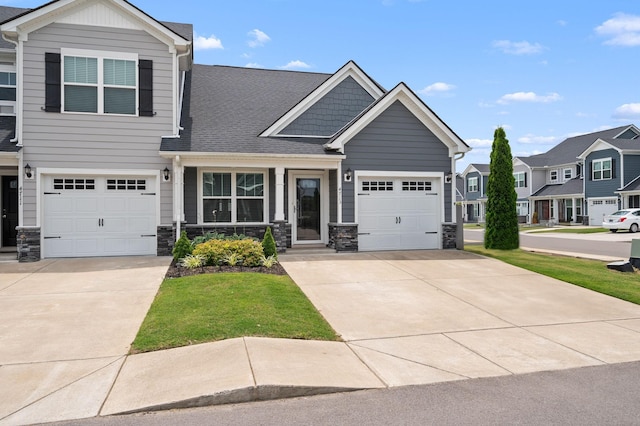 4713 Pompano Ln, Murfreesboro, TN 37128 - craftsman-style home with concrete driveway, roof with shingles, a residential view, and stone siding