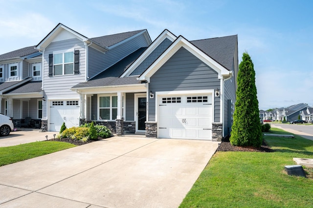 4713 Pompano Ln, Murfreesboro, TN 37128 - craftsman inspired home with driveway, a front lawn, stone siding, a garage, and roof with shingles