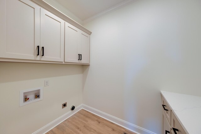 10 Henkle Dr, Loretto, TN 38469 - laundry area with cabinet space, washer hookup, light wood-style flooring, crown molding, and baseboards