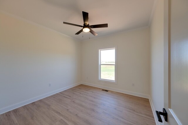10 Henkle Dr, Loretto, TN 38469 - unfurnished room with light wood finished floors, crown molding, a ceiling fan, and baseboards