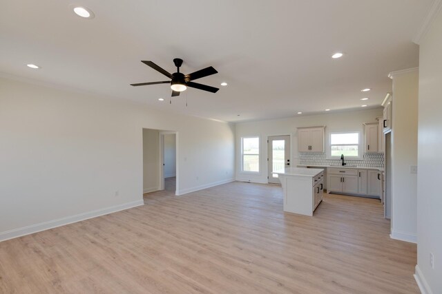 10 Henkle Dr, Loretto, TN 38469 - unfurnished living room featuring a sink, light wood finished floors, baseboards, recessed lighting, and ceiling fan