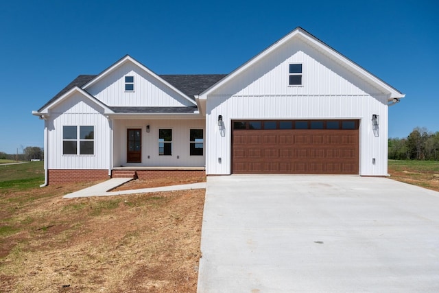 10 Henkle Dr, Loretto, TN 38469 - modern inspired farmhouse with an attached garage, covered porch, driveway, roof with shingles, and board and batten siding