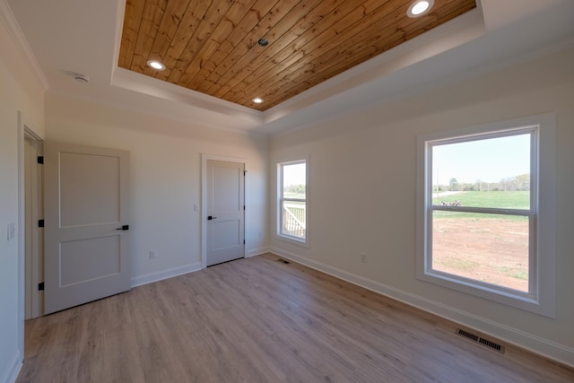 10 Henkle Dr, Loretto, TN 38469 - unfurnished bedroom featuring a tray ceiling, wooden ceiling, crown molding, wood finished floors, and baseboards