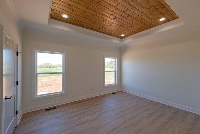 10 Henkle Dr, Loretto, TN 38469 - unfurnished room with a raised ceiling, wooden ceiling, plenty of natural light, wood finished floors, and crown molding