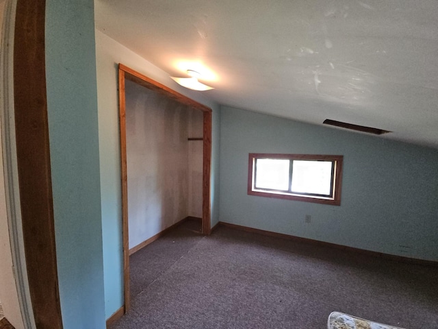 241 Peterson Loop, Holladay, TN 38341 - unfurnished bedroom featuring vaulted ceiling, carpet, a closet, and baseboards