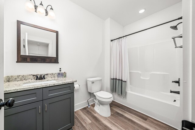 425 Royal Dr, Rock Island, TN 38581 - full bathroom featuring toilet, wood finished floors, vanity, shower / tub combo with curtain, and baseboards