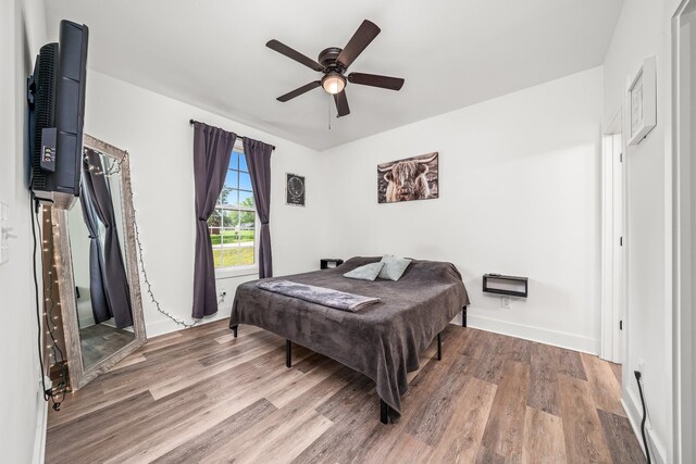 425 Royal Dr, Rock Island, TN 38581 - bedroom with wood finished floors, ceiling fan, and baseboards