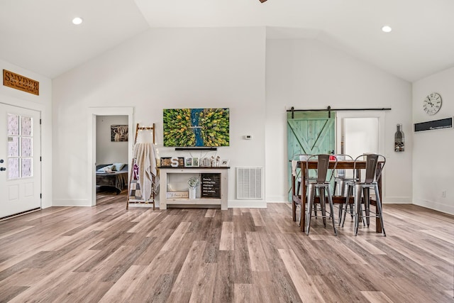 425 Royal Dr, Rock Island, TN 38581 - living area featuring high vaulted ceiling, a barn door, wood finished floors, baseboards, and recessed lighting