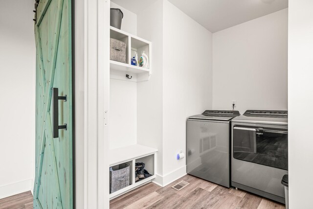 425 Royal Dr, Rock Island, TN 38581 - laundry room featuring washer and dryer, wood finished floors, and baseboards