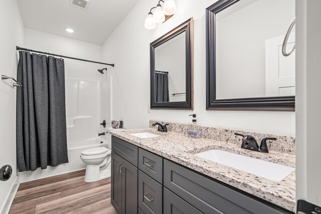 425 Royal Dr, Rock Island, TN 38581 - full bathroom with toilet, double vanity, wood finished floors, and shower / tub combo with curtain