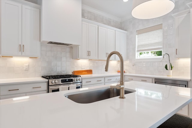 2123 Scott Ave Unit A, Nashville, TN 37216 - kitchen with stainless steel gas stove, a sink, extractor fan, light countertops, and white cabinetry