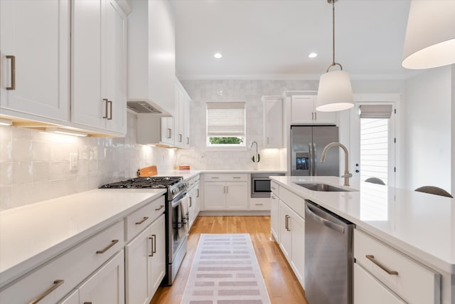 2123 Scott Ave Unit A, Nashville, TN 37216 - kitchen with appliances with stainless steel finishes, a sink, light wood-type flooring, white cabinets, and recessed lighting