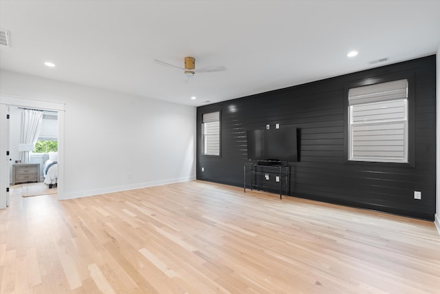 2123 Scott Ave Unit A, Nashville, TN 37216 - unfurnished living room with wood finished floors, a ceiling fan, an accent wall, baseboards, and recessed lighting