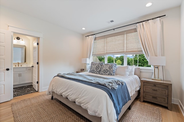 2123 Scott Ave Unit A, Nashville, TN 37216 - bedroom with light wood finished floors, recessed lighting, baseboards, and ensuite bath