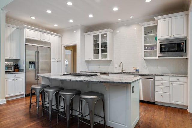 2754 Broyles Ln, Franklin, TN 37069 - kitchen with built in appliances, a center island, crown molding, white cabinetry, and a sink