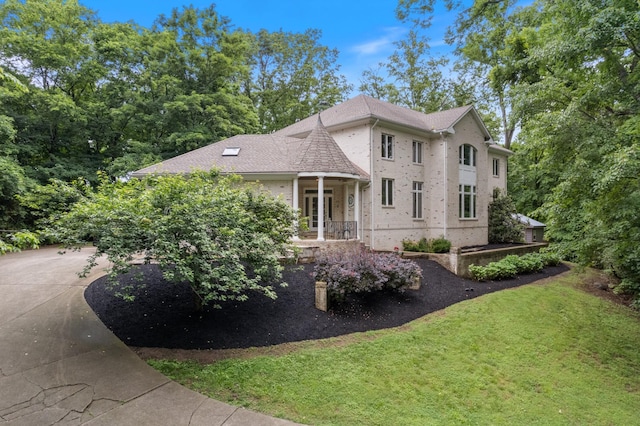 2754 Broyles Ln, Franklin, TN 37069 - view of front facade featuring a front lawn, brick siding, and covered porch