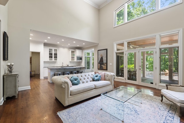 2754 Broyles Ln, Franklin, TN 37069 - living room with crown molding, dark wood-type flooring, a towering ceiling, recessed lighting, and a ceiling fan