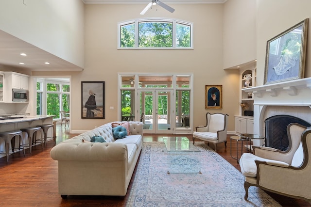2754 Broyles Ln, Franklin, TN 37069 - living room featuring a high ceiling, a fireplace, baseboards, dark wood-style floors, and a ceiling fan