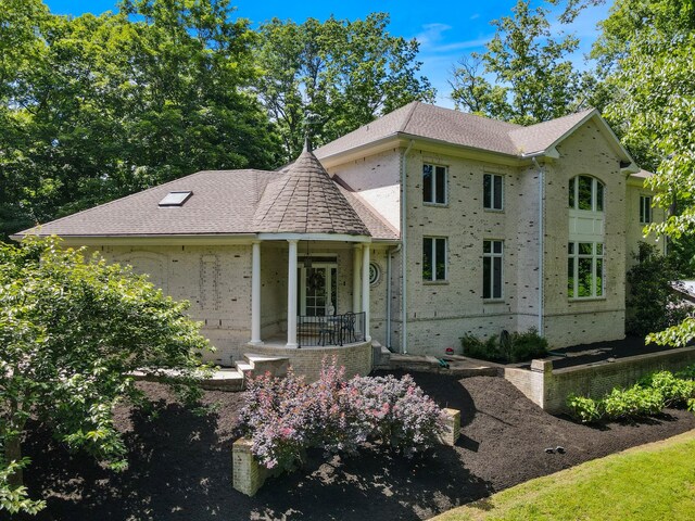 2754 Broyles Ln, Franklin, TN 37069 - view of front of house with brick siding, roof with shingles, and covered porch