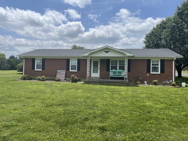 1700 Ellington Dr, Lafayette, TN 37083 - ranch-style house featuring a porch, brick siding, and a front lawn
