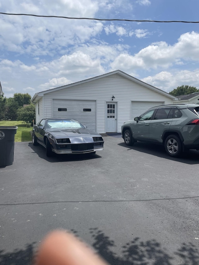1700 Ellington Dr, Lafayette, TN 37083 - view of side of property with a garage and an outbuilding