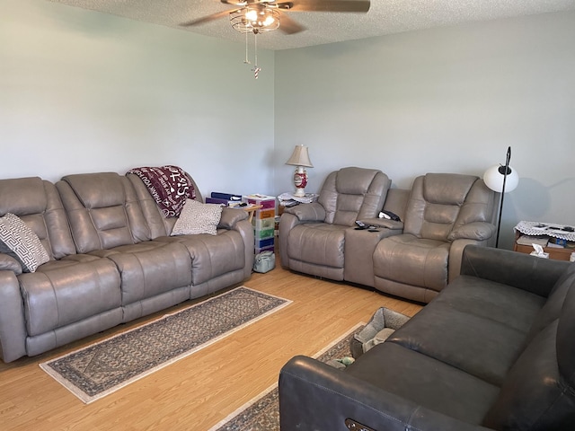 1700 Ellington Dr, Lafayette, TN 37083 - living area featuring ceiling fan, wood finished floors, and a textured ceiling