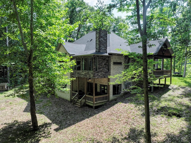 1288 Rogues Fork Rd, Bethpage, TN 37022 - back of property with brick siding, a chimney, roof with shingles, and a wooden deck