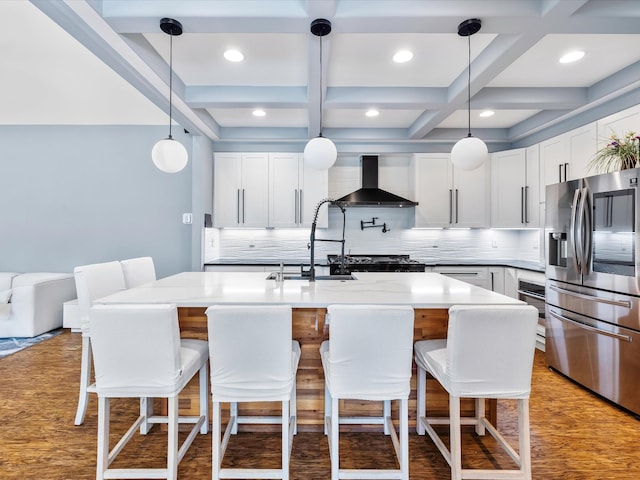 1288 Rogues Fork Rd, Bethpage, TN 37022 - kitchen with stainless steel fridge, wall chimney range hood, light wood-style flooring, light countertops, and coffered ceiling