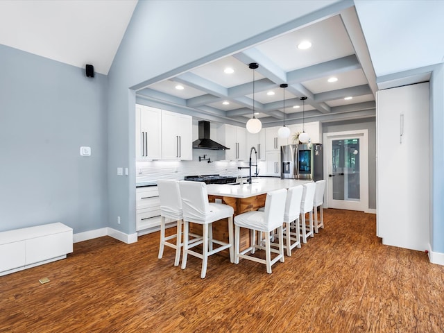 1288 Rogues Fork Rd, Bethpage, TN 37022 - kitchen with stainless steel refrigerator with ice dispenser, wall chimney exhaust hood, dark wood-type flooring, a center island with sink, and coffered ceiling