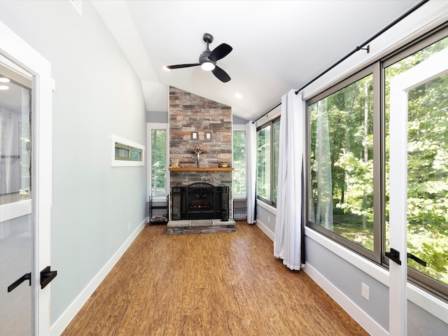 1288 Rogues Fork Rd, Bethpage, TN 37022 - unfurnished living room featuring vaulted ceiling, ceiling fan, wood finished floors, and a stone fireplace