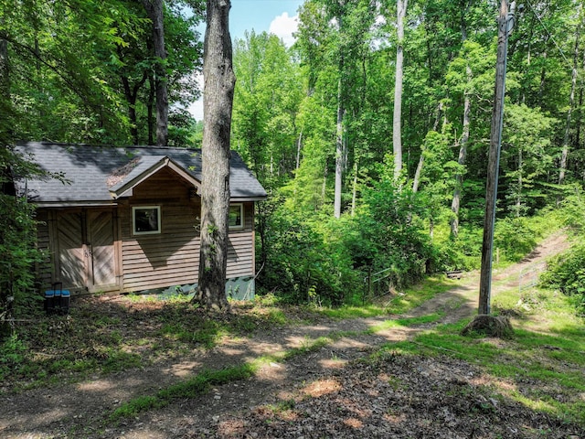 1288 Rogues Fork Rd, Bethpage, TN 37022 - view of property exterior featuring a shingled roof and a view of trees
