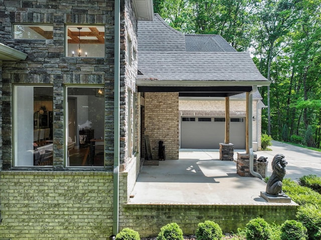 1288 Rogues Fork Rd, Bethpage, TN 37022 - view of side of home featuring roof with shingles, a garage, and concrete driveway