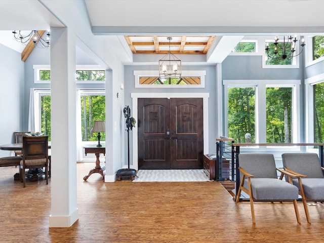 1288 Rogues Fork Rd, Bethpage, TN 37022 - foyer featuring a chandelier, wood finished floors, coffered ceiling, beamed ceiling, and a towering ceiling
