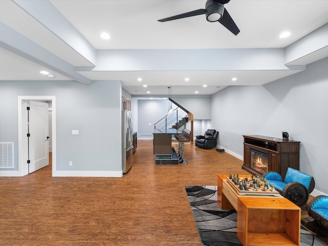 1288 Rogues Fork Rd, Bethpage, TN 37022 - living room featuring wood finished floors, stairway, a ceiling fan, recessed lighting, and a glass covered fireplace