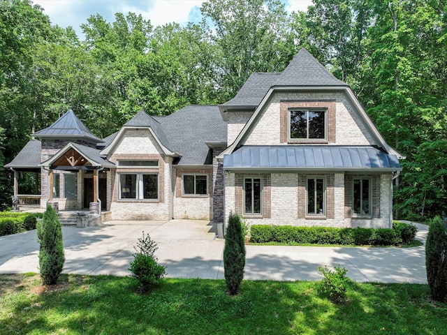1288 Rogues Fork Rd, Bethpage, TN 37022 - view of front facade featuring a standing seam roof and brick siding