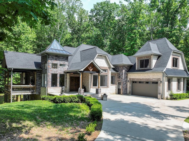 1288 Rogues Fork Rd, Bethpage, TN 37022 - view of front facade with driveway, a standing seam roof, and view of scattered trees