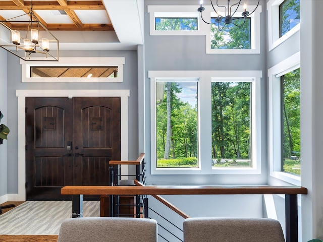 1288 Rogues Fork Rd, Bethpage, TN 37022 - entryway featuring a chandelier, coffered ceiling, healthy amount of natural light, and beamed ceiling