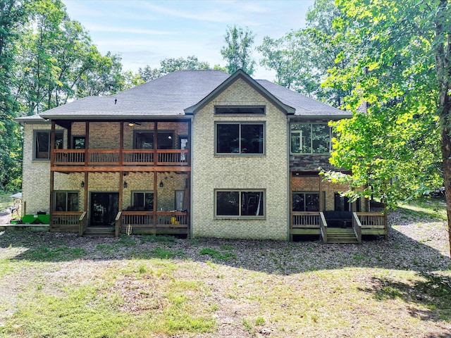 1288 Rogues Fork Rd, Bethpage, TN 37022 - back of house with a wooden deck, brick siding, and a lawn