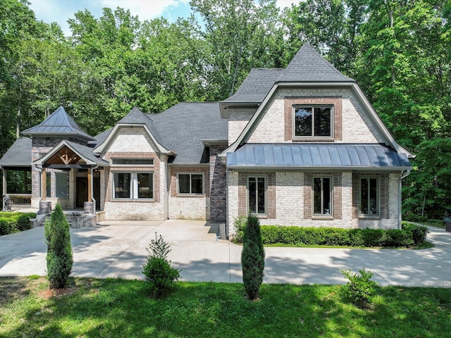 1288 Rogues Fork Rd, Bethpage, TN 37022 - view of front facade featuring a standing seam roof and brick siding